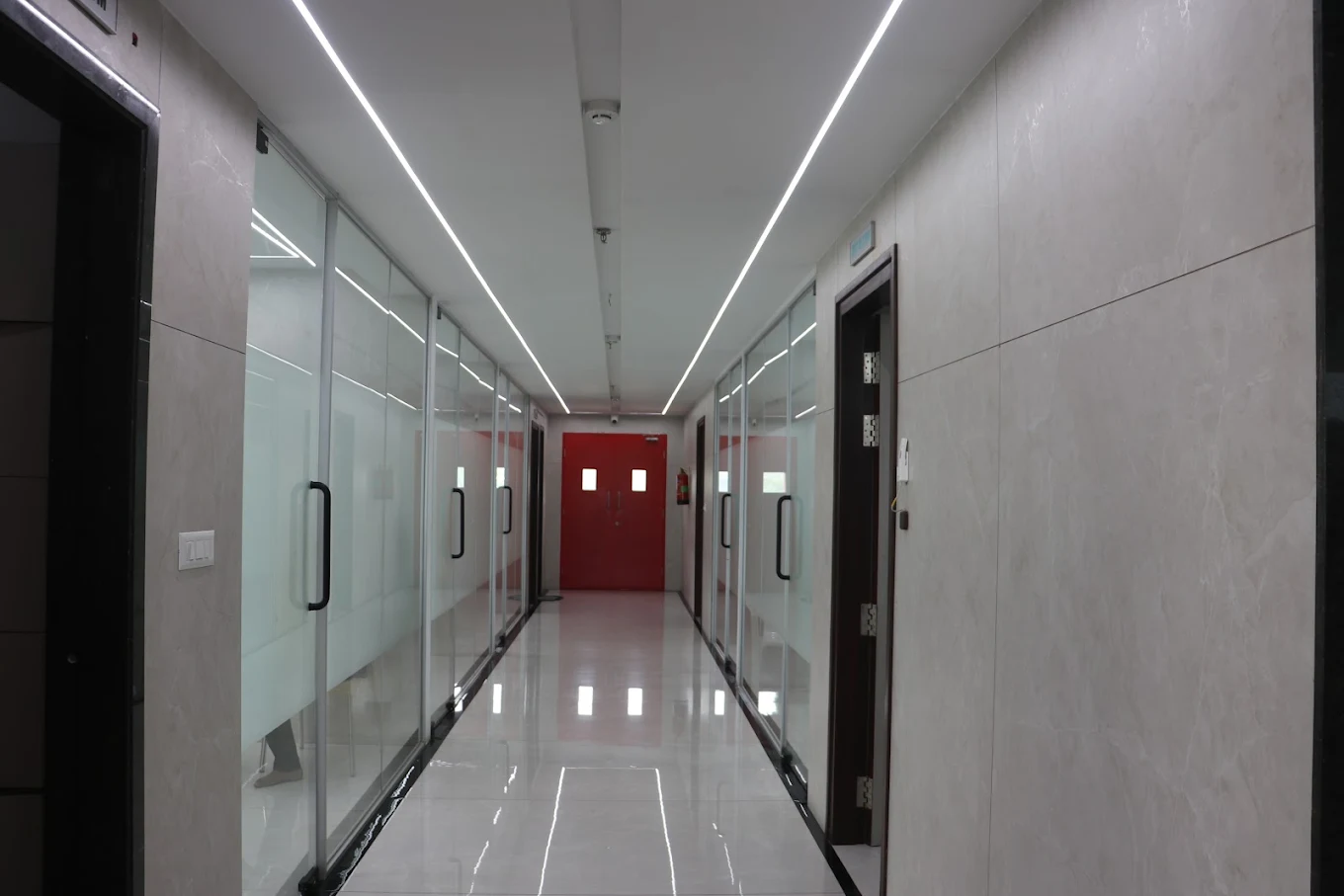 The treatment-room corridor at Leela Super Speciality Dental Hospital.