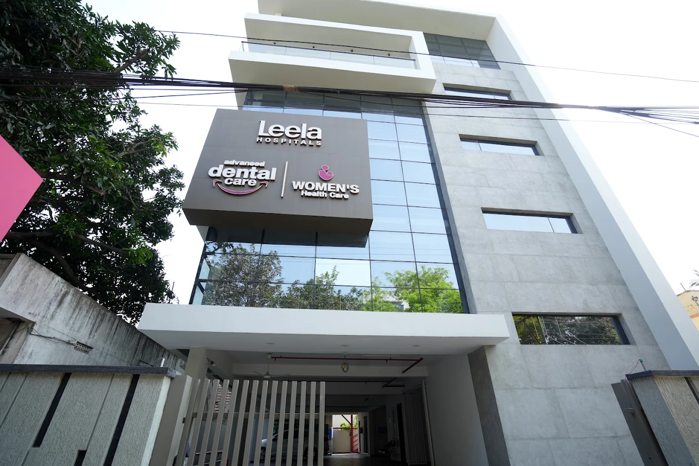 The Leela Hospitals building on Madhav Nagar, Kakinada, with the dental-care signboard.